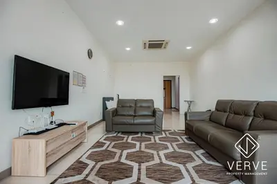 a living room with a couch and a flat screen tv at Ipoh Octagon Premium Suites by Verve in Ipoh