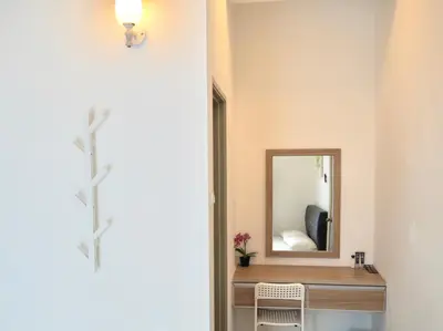 a bathroom with a vanity and a mirror at The PENT Duplex Cameron in Tanah Rata