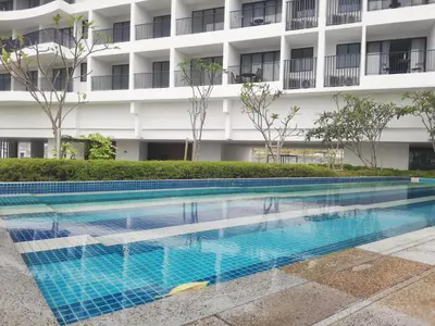 a swimming pool in front of a building at Landmark By Katana 4BR Romantic Seaview Homestay Gurney\u65e0\u654c\u6d77\u666f\u56db\u623f\u5957\u623f in Tanjong Tokong