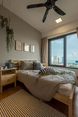 a bedroom with a bed with a ceiling fan and a window at \u6d77\u666f\u623f Seaview 218 Macalister (Georgetown) \u4e54\u6cbb\u5e02\u4e2d\u5fc3 9pax in George Town