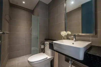 a bathroom with a white toilet and a sink at \u6d77\u666f\u623f Seaview 218 Macalister (Georgetown) \u4e54\u6cbb\u5e02\u4e2d\u5fc3 9pax in George Town