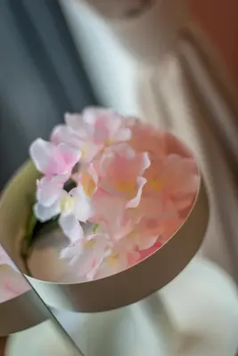 a pink flower in a bowl on a table at \u6d77\u666f\u623f Seaview 218 Macalister (Georgetown) \u4e54\u6cbb\u5e02\u4e2d\u5fc3 9pax in George Town