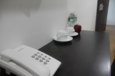 a remote control sitting on top of a table at Big Apple Hotel in Kulim