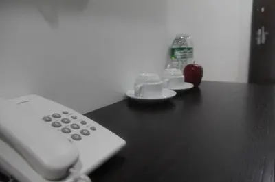a remote control sitting on top of a table at Big Apple Hotel in Kulim