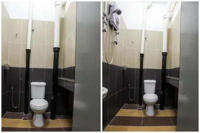 a bathroom with two toilets and a sink at OYO 89549 Casavilla Hotel (city Centre) Taiping in Taiping