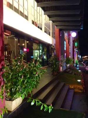 a building with a bunch of plants in front of it at De Botani Hotel in Ipoh