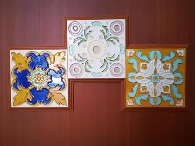 three different colored art on the wall at Mclane Boutique Hotel in George Town
