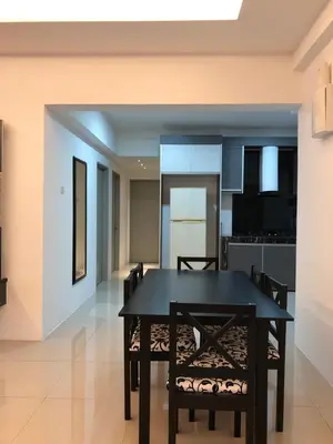 a dining room and kitchen with a black table and chairs at KJ Homestay Casa Kayangan in Ipoh