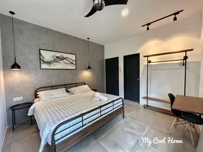a bedroom with a bed and a ceiling fan at My Cool Home x The Quintet @ Cameron Highlands in Tanah Rata