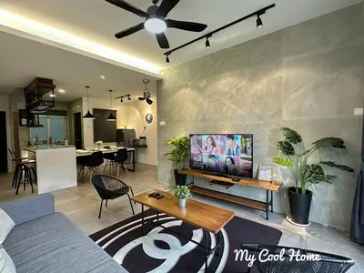 a living room with a couch and a flat screen tv at My Cool Home x The Quintet @ Cameron Highlands in Tanah Rata