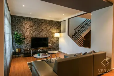 a living room with a couch and a tv at L&P Boutique Residence by Verve (14 Pax) EECH40 in Ipoh