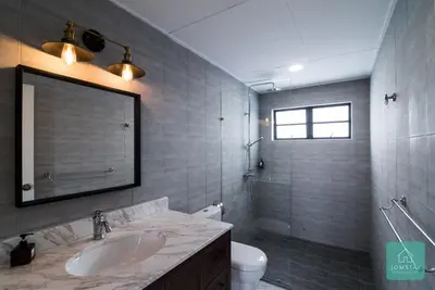 a bathroom with a sink and a toilet and a mirror at Jomstay Mayhaven Villa (Ipoh) in Ipoh