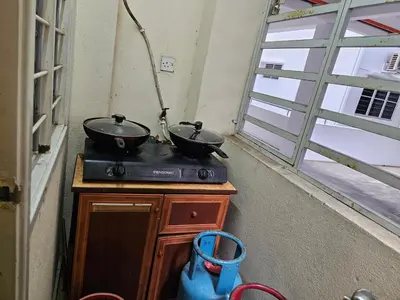 two pots on top of a stove in a room at Jeffrey Homestay Ipoh R at Lost World of Tambun in Tambun