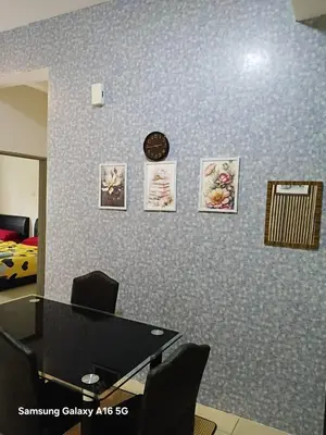 a meeting room with a table and a clock on a wall at Galina Somersquare Goldenhills Aprt Pasar Malam Cameron Highlands in Brinchang