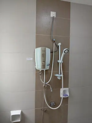 a shower in a bathroom with a shower head at Galina Somersquare Goldenhills Aprt Pasar Malam Cameron Highlands in Brinchang