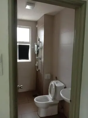 a bathroom with a toilet and a sink at Galina Somersquare Goldenhills Aprt Pasar Malam Cameron Highlands in Brinchang
