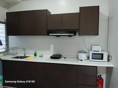 a kitchen with a sink and a microwave at Galina Somersquare Goldenhills Aprt Pasar Malam Cameron Highlands in Brinchang