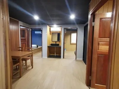a room with a table and a dining room at Tatami D'Tepi Laut - PANGKOR ISLAND in Pangkor