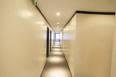 a long hallway with a long hallway at HOTEL PREMIUM in Ipoh