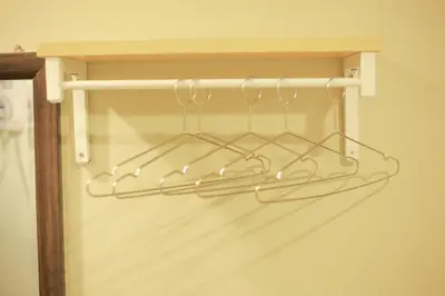 a towel rack in a closet with silver hooks at HOTEL PREMIUM in Ipoh
