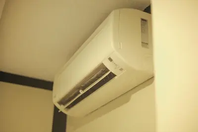 a white toaster oven hanging on a wall at HOTEL PREMIUM in Ipoh