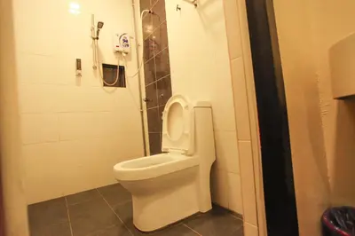 a bathroom with a toilet in a stall at HOTEL PREMIUM in Ipoh