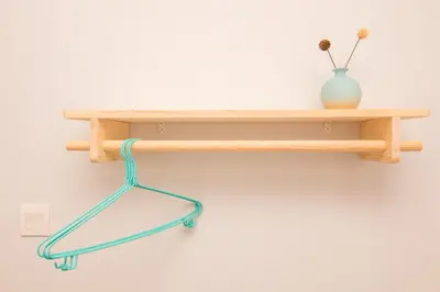 a wooden shelf hanging on a white wall with a greenledge at Cameron Highlands Modern7-Tea Plantation View-Premium Hotel Bed in Kampung Kuala Terla