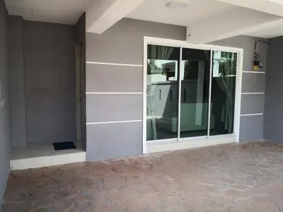 a room with a glass door on a wall at My Homestay N18 (14 pax) @ Golden Hills Night Market in Brinchang