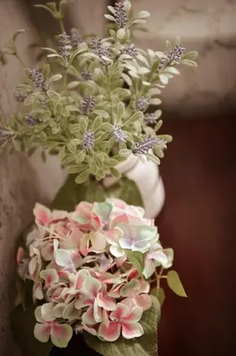 a bouquet of pink and white flowers in a vase at By the sea Duplex penthouse baby in Batu Ferringhi