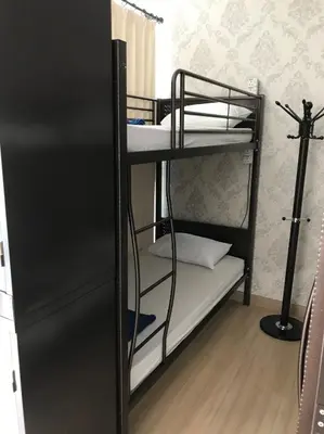 a couple of bunk beds in a room at Island Hostel Bayan Lepas Airport in Bayan Lepas
