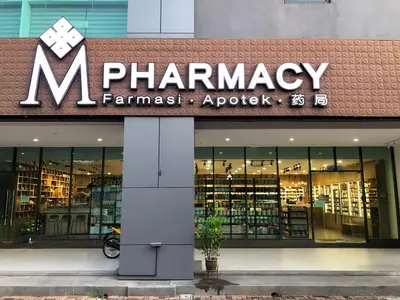 a pharmacy sign on the front of a store at Jazz Service Suites Penang in George Town