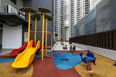 a playground with a slide in a building at Jazz Service Suites Penang in George Town