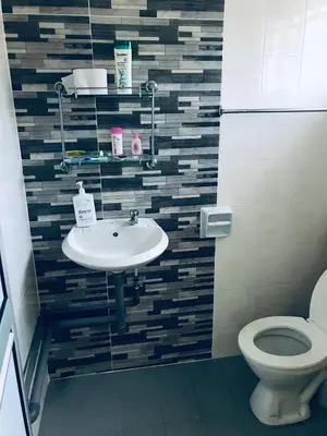 a bathroom with a sink and a toilet at CoZy and comfortable Homestay in sungai siput in Sungai Siput