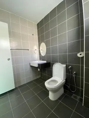 a bathroom with a toilet and a sink and a mirror at Golden Sweet Home @ CH Golden Hills (Night Market) in Cameron Highlands
