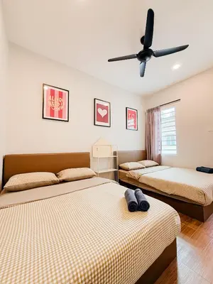 a bedroom with two beds and a ceiling fan at Golden Sweet Home @ CH Golden Hills (Night Market) in Cameron Highlands