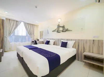a bedroom with a large bed in a room at Avatel Bukit Mertajam in Bukit Mertajam