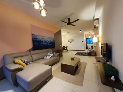 a living room with a couch and a ceiling fan at Landmark by Katana 3BR Romantic Luxury Seaview Homestay Gurney\u65e0\u654c\u6d77\u666f\u4e09\u623f\u5957\u623f in Tanjong Tokong