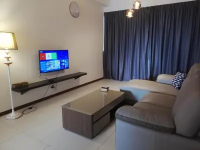 a living room with a couch and a tv at Landmark by Katana 3BR Romantic Luxury Seaview Homestay Gurney\u65e0\u654c\u6d77\u666f\u4e09\u623f\u5957\u623f in Tanjong Tokong