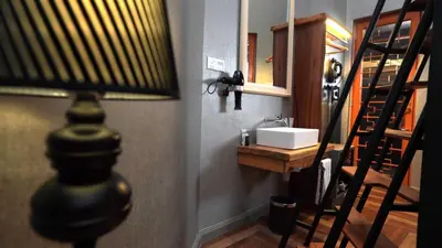a bathroom with a sink and a mirror at 1969 Business Suites @ Ipoh Garden in Ipoh