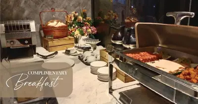 a buffet with food on a table in a room at 1969 Business Suites @ Ipoh Garden in Ipoh