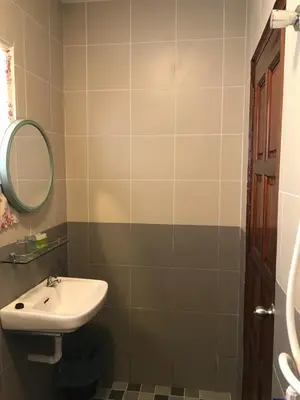 a bathroom with a sink and a mirror at Art Heritage at Lucky 7 in Ipoh