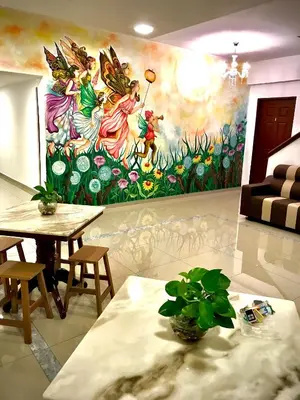 a living room with a painting on the wall at Art Heritage at Lucky 7 in Ipoh