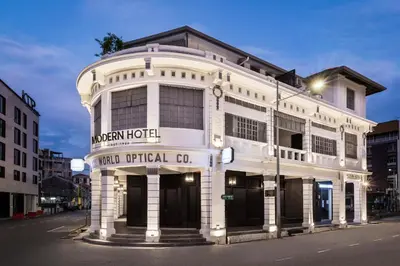 a white building with a hotel at Modern Hotel Georgetown in George Town