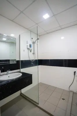 a bathroom with a shower and a sink at Seaview Mansion One Georgetown in George Town