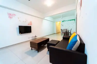 a living room with a couch and a tv at Star Light Homestay 19@ The Venus in Sitiawan