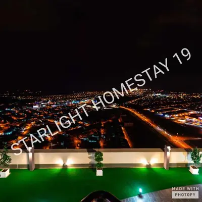 a lit up sign for a city at night at Star Light Homestay 19@ The Venus in Sitiawan