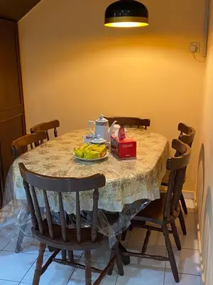 a dining room table with a plate of food on it at PJM HILL VIEW HOMESTAY in Ipoh