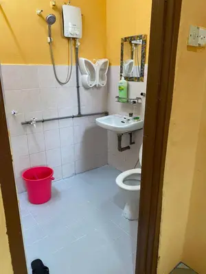 a bathroom with a toilet and a sink at PJM HILL VIEW HOMESTAY in Ipoh