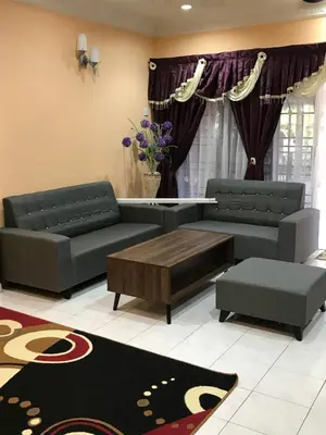 a living room with two couches and a coffee table at PJM HILL VIEW HOMESTAY in Ipoh