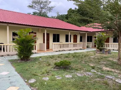 a house with a red roof at PANGKOR PURNAMA CHALET in Pangkor